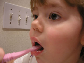 Brush your teeth to help prevent tooth disease.